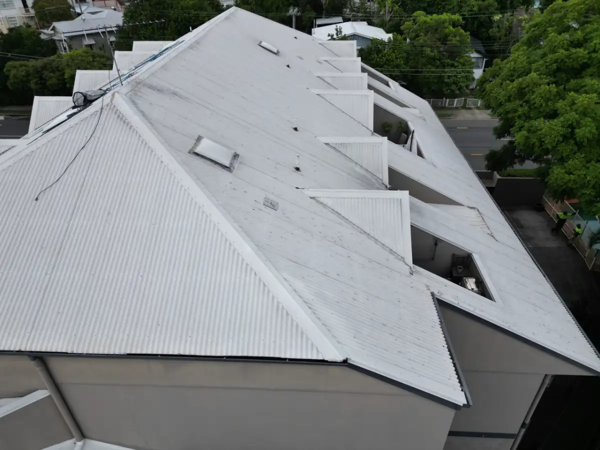 Close aerial view of metal roof sheeting and flashings